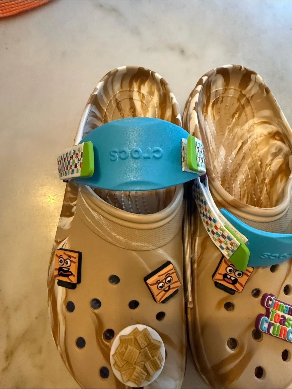 CROCS Beige Marbled Clog with Bright Blue Strap and Multicolor Charms